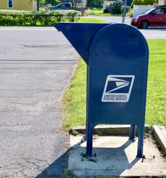 A US Postal Service Mailbox on a suburban street