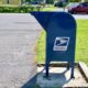 A US Postal Service Mailbox on a suburban street