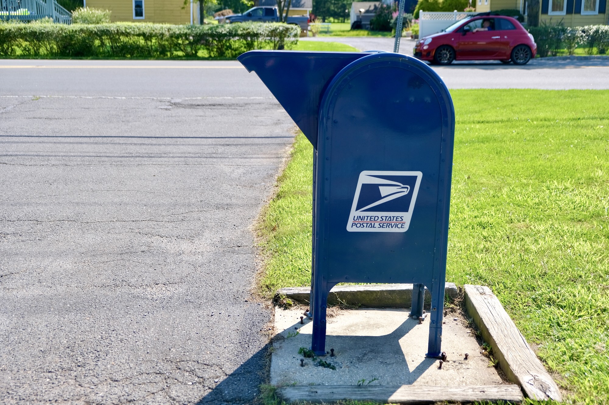 A US Postal Service Mailbox on a suburban street