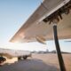 Refueling of airplane at airport. Ground service before flight.